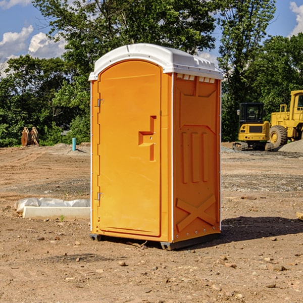 what is the cost difference between standard and deluxe portable restroom rentals in Violet